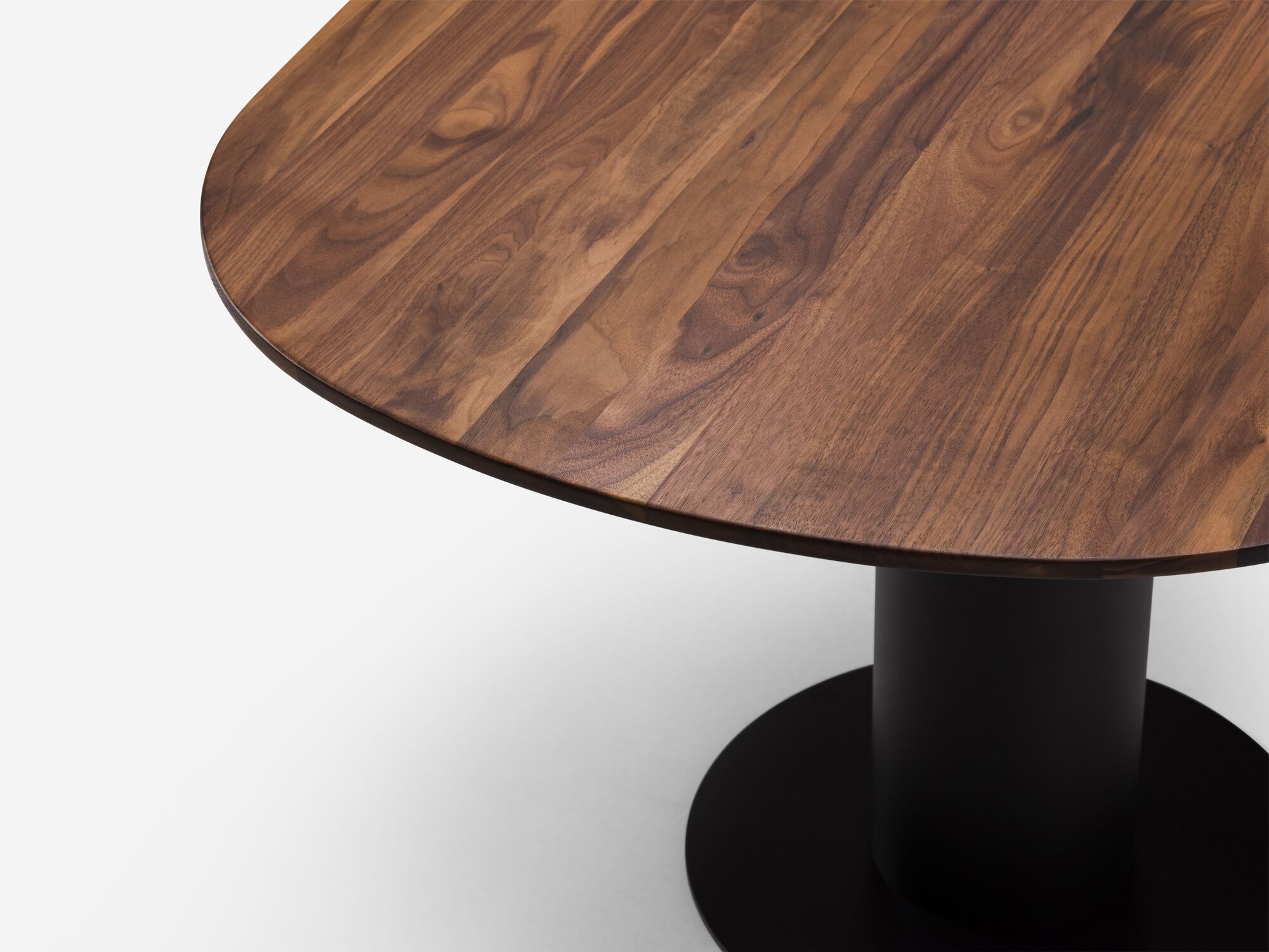 Detail angle view of extra small walnut dining table